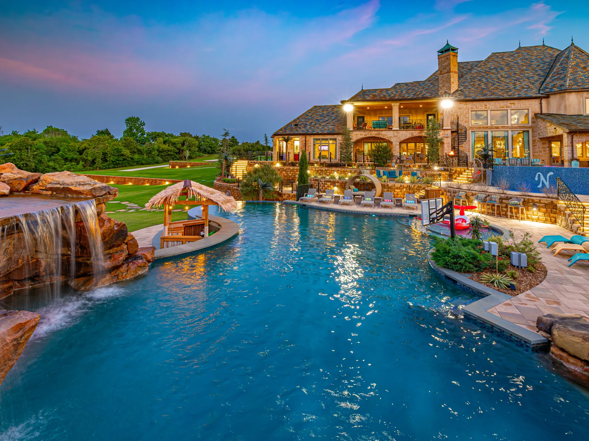 Pool & Grounds at 36 Acres OKC — resort-style pool and illuminated staircase