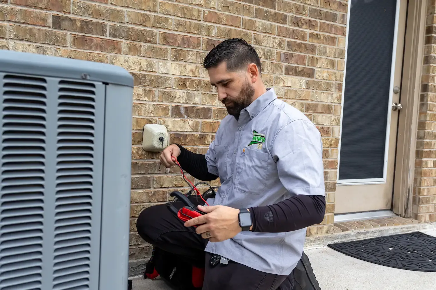 Bob's AC technician servicing an HVAC unit
