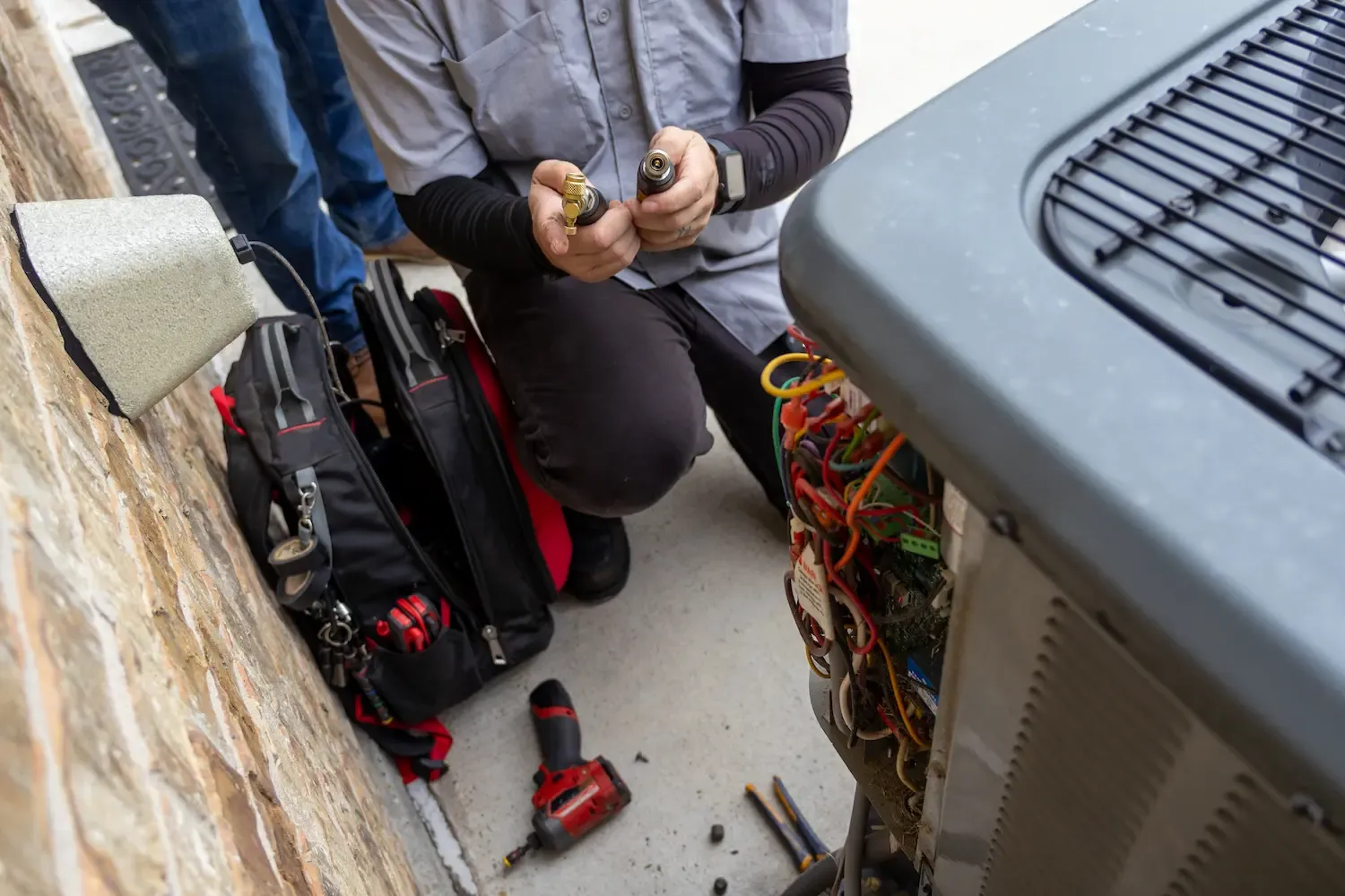 Bob's AC technician inspecting HVAC components